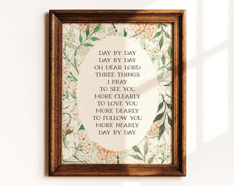 May include: A dark wood frame containing a print with a cream-colored oval center featuring the text: DAY BY DAY DAY BY DAY OH DEAR LORD THREE THINGS I PRAY TO SEE YOU MORE CLEARLY TO LOVE YOU MORE DEARLY TO FOLLOW YOU MORE NEARLY DAY BY DAY.
