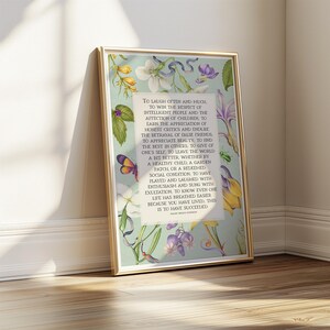 Print of Ralph Waldo Emerson Success poem written in a white center rectangle, surrounded by a background of light blue with vintage floral artwork. Pictured in a thin gold frame.