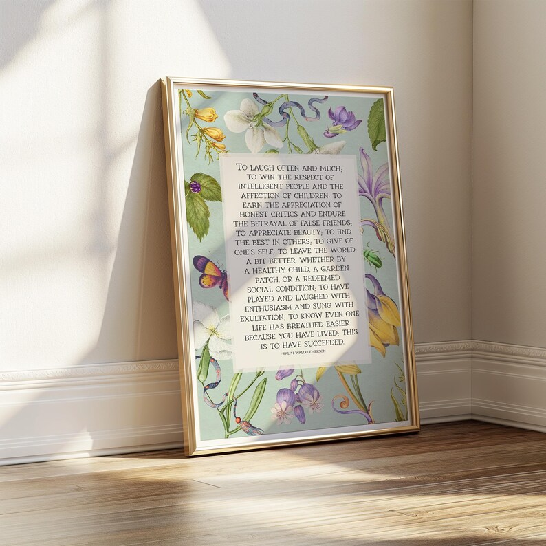 Print of Ralph Waldo Emerson Success poem written in a white center rectangle, surrounded by a background of light blue with vintage floral artwork. Pictured in a thin gold frame.