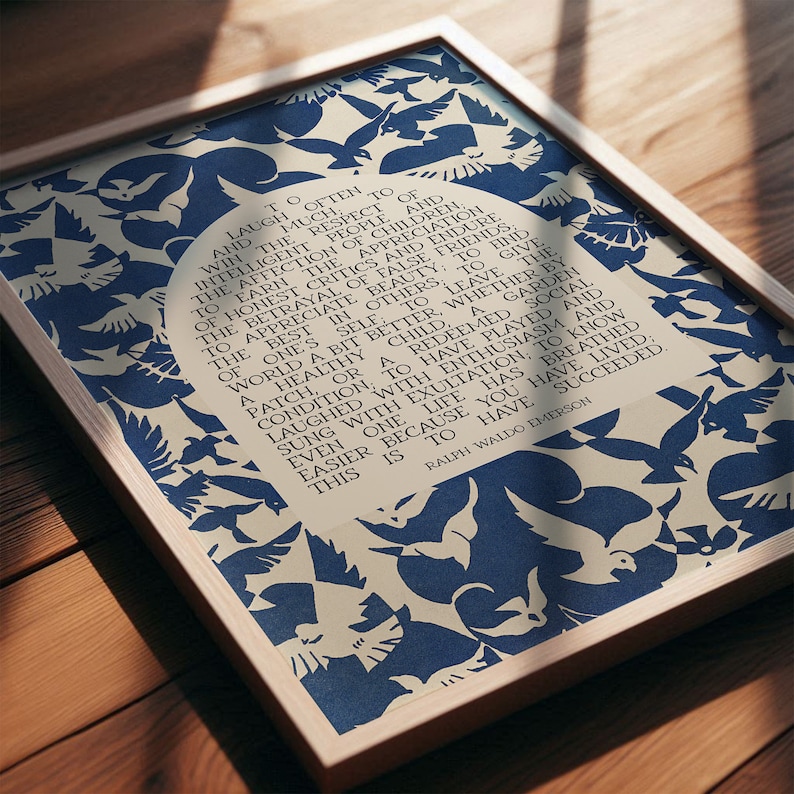 Print of Ralph waldo emerson success quote with text placed in a beige arch in the center and surrounded by an abstract midcentury blue and off white bird pattern