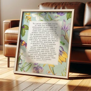 Print of Ralph Waldo Emerson Success poem written in a white center rectangle, surrounded by a background of light blue with vintage floral artwork. Pictured in wood frame.