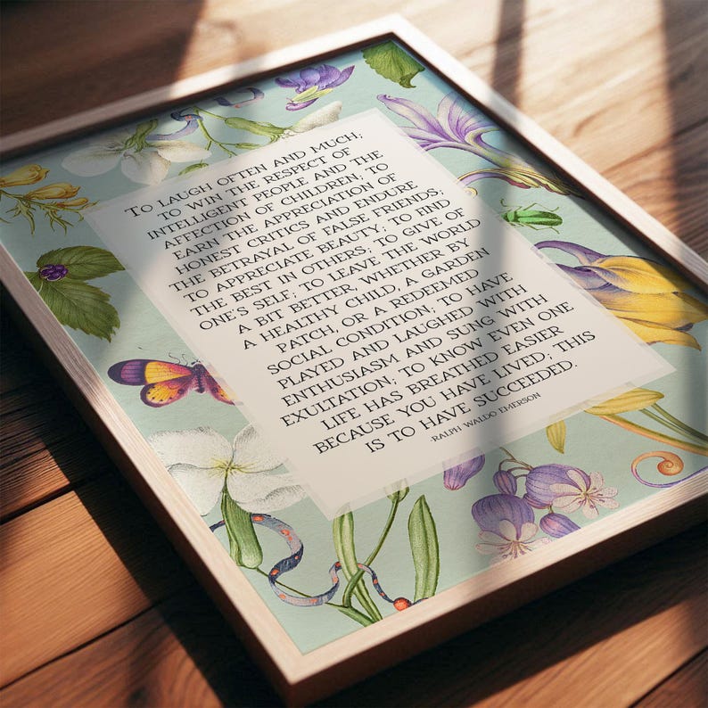 Print of Ralph Waldo Emerson Success poem written in a white center rectangle, surrounded by a background of light blue with vintage floral artwork. Pictured in a thin wood frame.