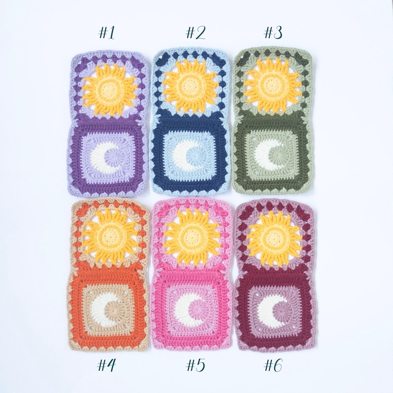 May include: A collection of six crocheted squares in various colors. Each square features a yellow sun design on top and a white crescent moon on the bottom. The squares are in shades of purple, blue, green, orange, pink, and burgundy.
