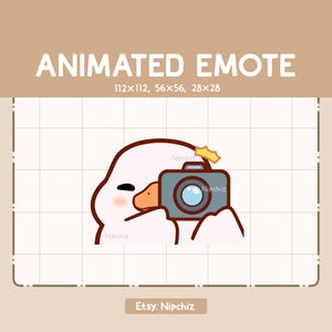 May include: Animated emote of a white cartoon goose holding a camera with a flash. The goose has a pink blush on its cheek and is looking at the camera. The camera is gray with a black lens and a brown strap. The background is a grid pattern.