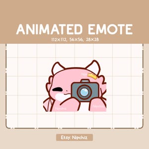 May include: Animated pink dragon emote holding a camera with a crown on its head. The emote is available in three sizes: 112x112, 56x56, and 28x28.
