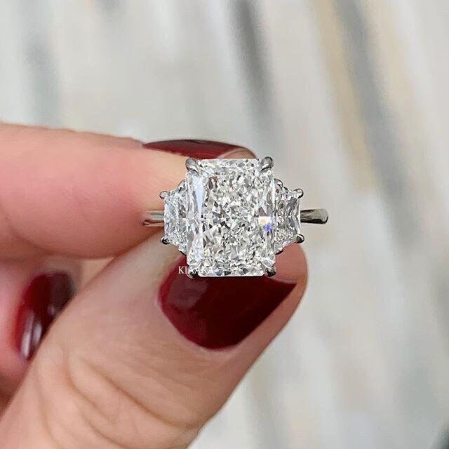 Radiant cut three stone engagement best sale ring