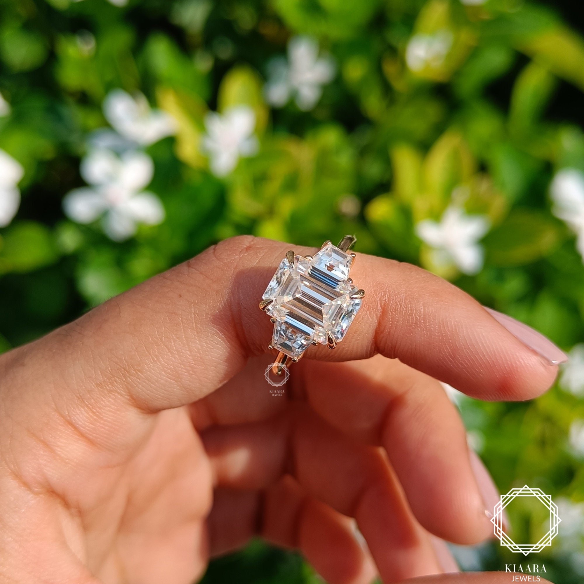 Three stone emerald cut engagement rings hot sale