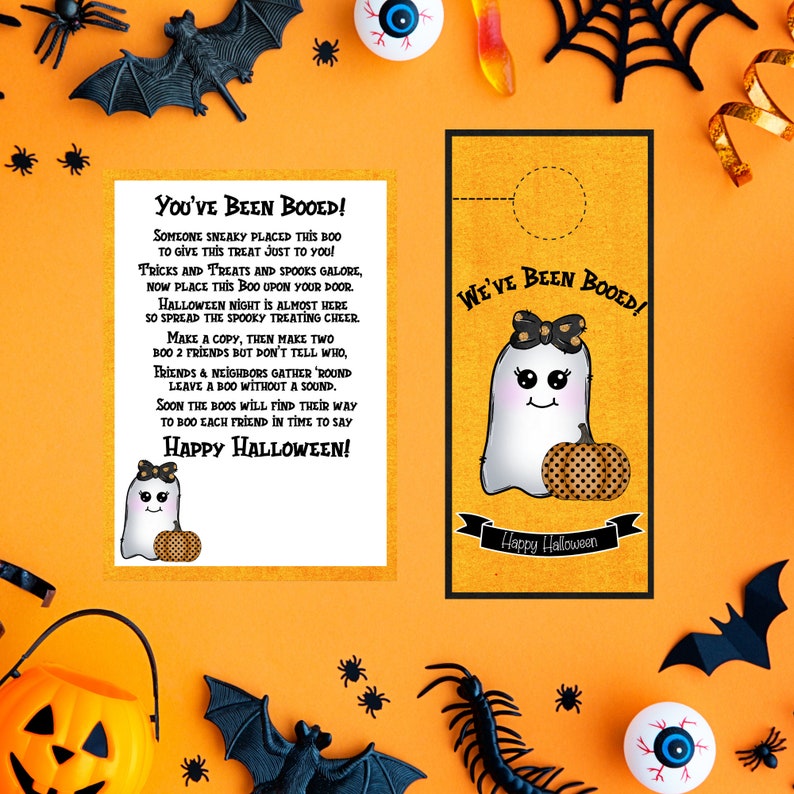 May include: Two printable Halloween door hangers featuring a cute ghost with a pumpkin. The text on the door hangers reads "You've Been Booed!" and "We've Been Booed!"