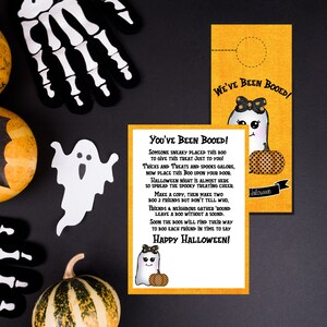 May include: Two printable Halloween door hangers featuring a cute ghost with a pumpkin. The text on the door hangers reads "You've Been Booed!" and "We've Been Booed!"