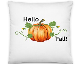 May include: White square cushion featuring a watercolour illustration of an orange pumpkin, green vines, and the words "Hello Fall!" in black text. A seasonal home decor item.