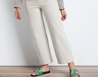 Hmong inspired green lis loos flower Women's slides