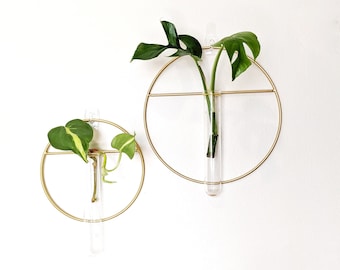 Propagation Station, Metal Circle with a cross bar, minimal design and hangs on wall