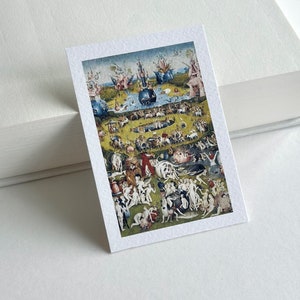 May include: A detailed painting depicting a crowded scene with numerous figures, animals, and objects. The painting is set in a verdant landscape with a blue pond at its centre. The figures are mostly nude and are engaged in various activities, including dancing, playing music, and eating. The painting is rich in symbolism and is considered a masterpiece of Renaissance art.