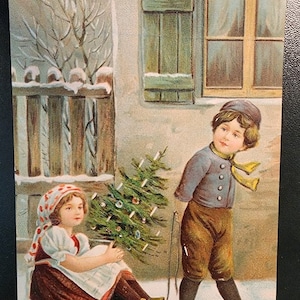 Vintage 1908 Christmas Postcard.  Boy Pulling Girl with Tree on Sled