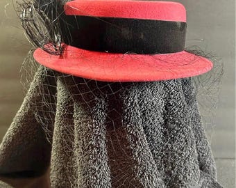 Vintage red wool felt pillbox (or cocktail) hat from 1950s.