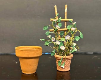 1/12 scale dollhouse miniature morning glory plant on a trellis.