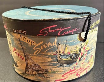 vintage hat box, Parisian-themed collectible, from the 1950s. w/ names of prominent French milliners