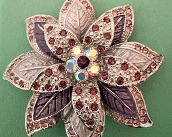 multi-layered floral (poinsettia- or multi-petal-style) brooch in silver-tone base metal