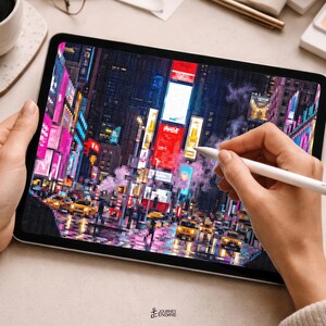 May include: A tablet displaying a pixelated digital illustration of a busy city street at night with bright neon signs, illuminated billboards, and yellow taxis. A white stylus is held against the screen, which features a grid-like pattern.