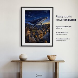 May include: A framed digital art print featuring a large whale swimming through a night sky above a village of small houses with glowing windows. The text on the right reads: Ready to print artwork included, High-resolution PNG + PDF sized for A3, Scalable SVG poster print up to 60x90 cm, No numbers, no outlines just the finished art.