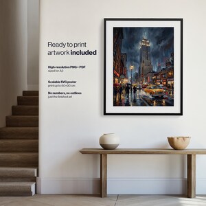 May include: A framed digital art print depicting a rainy New York City street scene at night, featuring the Empire State Building, yellow taxis, and pedestrians with umbrellas. The artwork is displayed in a black frame on a white wall.