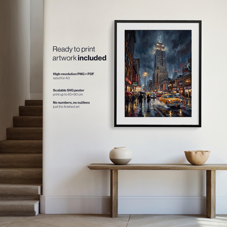 May include: A framed digital art print depicting a rainy New York City street scene at night, featuring the Empire State Building, yellow taxis, and pedestrians with umbrellas. The artwork is displayed in a black frame on a white wall.