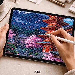 May include: A digital tablet displaying a pixel art illustration of a Japanese pagoda and cherry blossom trees in shades of red, pink, blue, and green. A white stylus is held against the screen, which also features a torii gate and mountains.