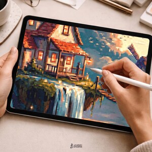May include: A tablet displaying a pixel art illustration of a house with a red roof situated above a waterfall. The digital artwork features a color palette of blues, oranges, and yellows. A white stylus is held against the screen surface.