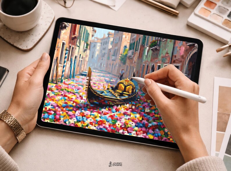 May include: A digital tablet displaying a pixel art illustration of a gondola floating on a canal in Venice, surrounded by a vibrant field of colorful flowers. The screen shows a detailed scene with buildings lining the water, rendered in a blocky, mosaic-like style with a white stylus held over the display.