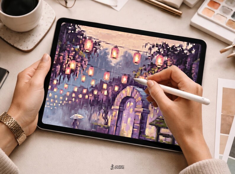 May include: A digital tablet displaying a pixel art illustration of a stone archway surrounded by purple foliage and glowing lanterns. The screen shows a detailed scene with warm light sources and a small figure holding an umbrella, rendered in a grid-based style.