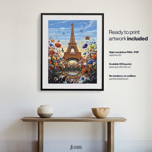 May include: A framed digital art print featuring the Eiffel Tower surrounded by a vibrant field of colorful wildflowers under a blue sky. The text on the right reads: Ready to print artwork included, High-resolution PNG + PDF sized for A3, Scalable SVG poster print up to 60x90 cm, No numbers, no outlines just the finished art.