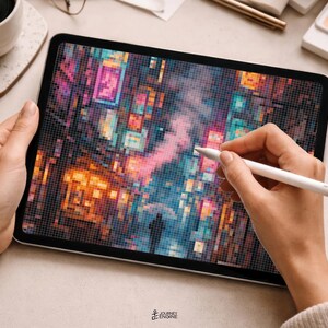 May include: A tablet displaying a pixelated digital artwork of a vibrant city street at night with glowing neon signs in shades of pink, blue, and orange. A white stylus is held against the screen, which shows a silhouette of a person with an umbrella.