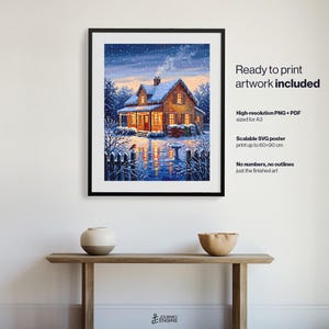 May include: A framed digital print of a snow-covered house at twilight with warm yellow light glowing from the windows. Text on the right reads: Ready to print artwork included, High-resolution PNG + PDF sized for A3, Scalable SVG poster print up to 60x90 cm, No numbers, no outlines just the finished art.