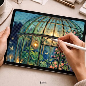 May include: A digital tablet displaying a pixel art illustration of a glass greenhouse at night, featuring glowing interior lights, lush green plants, and pink flowers. The screen shows a grid-based design with a white stylus resting on the surface.