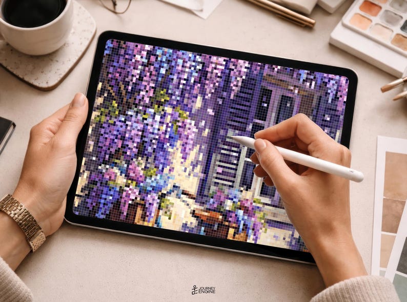 May include: A digital tablet displaying a pixel art illustration of purple wisteria flowers cascading over a window with dark shutters. The screen shows a vibrant mosaic of purple, blue, and green squares, with a white stylus held against the display.