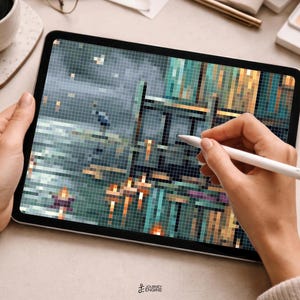 May include: A tablet displaying a pixelated digital artwork of a dark, moody landscape with a wooden structure, water, and a small bird. The screen shows a grid-like composition in shades of teal, blue, gray, and orange, with a white stylus touching it.