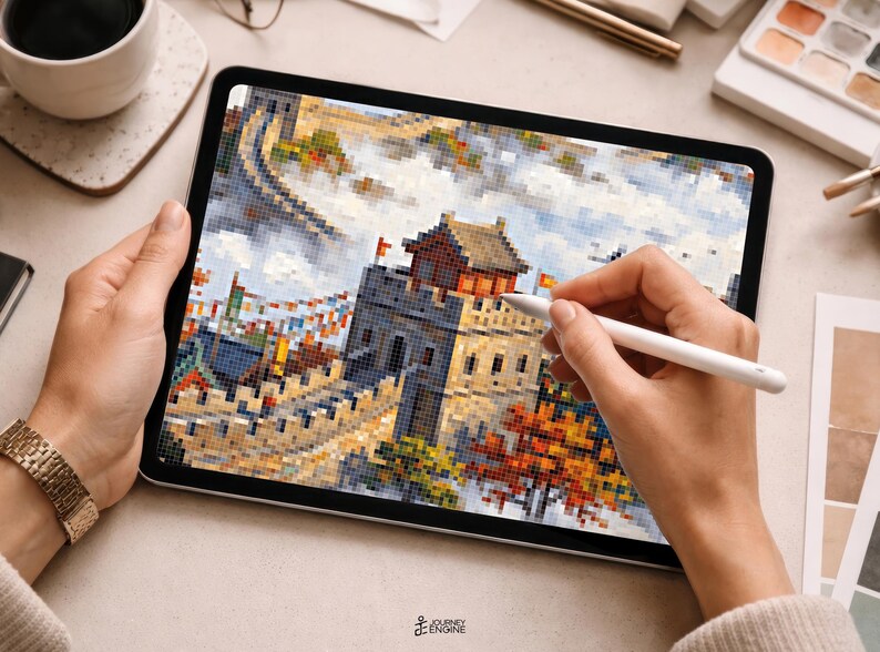 May include: A digital tablet displaying a pixel art illustration of the Great Wall of China. The artwork features a stone watchtower, winding wall sections, and autumn-colored trees under a cloudy sky. A white stylus is held against the screen.