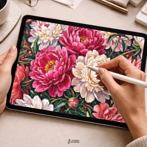 May include: A digital tablet displaying a pixelated floral illustration featuring vibrant pink, white, and red peonies with green foliage. The screen shows a detailed grid-based pattern of blooming flowers, and a white stylus is held near the display.