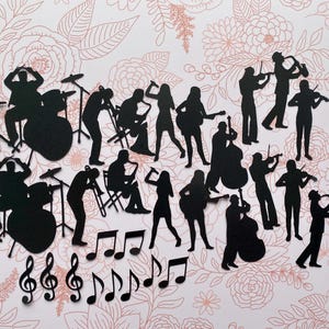 Silhouettes musicales noires, prédécoupées, prêtes à être insérées dans votre journal ou vos étiquettes, plus une carte de bingo décorée.