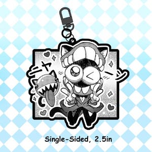 May include: Black and white cartoon keychain featuring a character with a large mouth, winking eye, and peace signs. A smaller character with a toothy grin and tongue is also present. The keychain is single-sided and measures 2.5 inches.