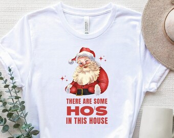 Ci sono alcuni ho in questa camicia di casa, c'è qualche maglietta di Hos, camicia di Babbo Natale divertente, maglietta di Babbo Natale carina, camicie di Babbo Natale di Natale, Natale TShirt