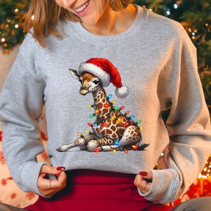Cute Christmas Giraffe Lights Sweatshirt, Funny Holiday Animal Sweater, Festive Lights Giraffe Hat Santa Gift Hoodie, Xmas Funny Giraffe