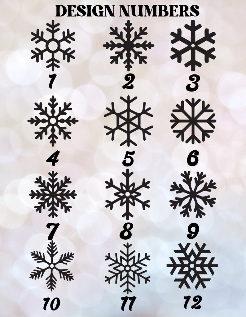May include: A set of 12 black snowflake designs numbered 1 through 12. The snowflakes are all different designs and are arranged in a grid.
