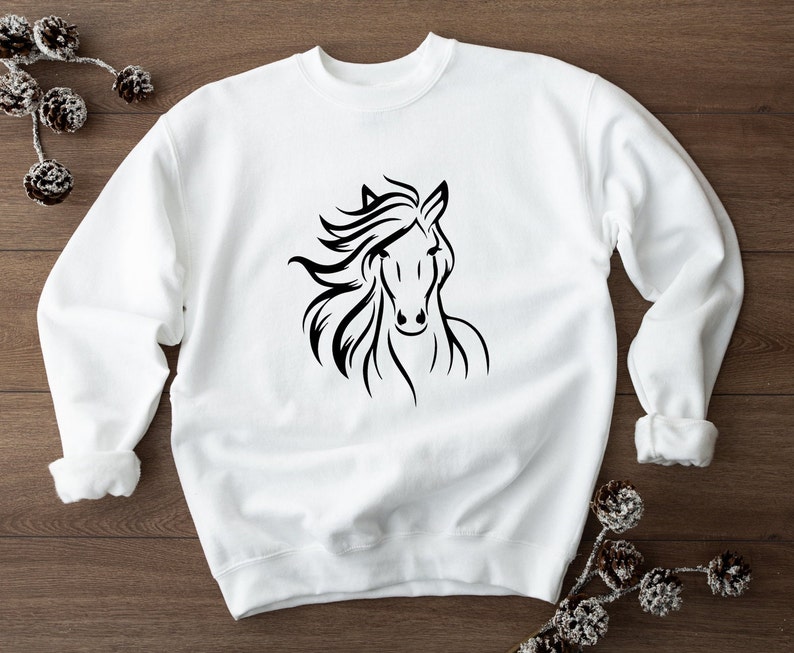 May include: White sweatshirt with a black silhouette of a horse's head.