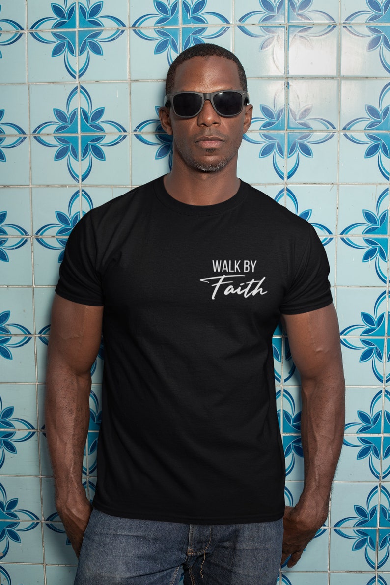 May include: A black t-shirt with the text "Walk by Faith" in white lettering.