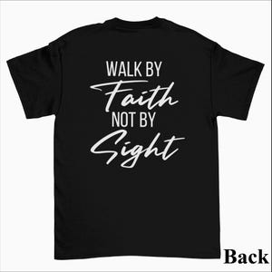 May include: Black t-shirt with white text that reads "Walk by Faith not by Sight".