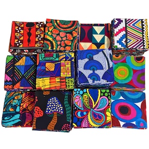 May include: A selection of patterned fabric squares in a variety of designs. The fabrics feature bold patterns, including geometric shapes and floral designs, in bright colours such as red, blue, green, and yellow. The material appears to be cotton or a similar fabric.