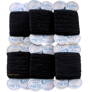 May include: A collection of black thread spools. Each spool is labeled with the text "91.44 m. THREAD" and "MADE IN CHINA". The brand name "Ceilingfan" is also visible on the labels. The thread is tightly wound and appears to be a sewing or crafting supply.
