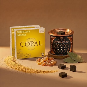 May include: Aromafume smokeless incense set with two yellow boxes of Copal incense, a black and copper incense burner, resin pieces, and incense bricks. The boxes read "SMOKELESS INCENSE" and "COPAL".