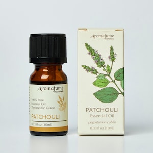 May include: A brown glass bottle with a black cap containing Patchouli Essential Oil. The bottle is labeled "Aromafume Naturals" and lists the oil as 100% pure, therapeutic grade. The bottle is 0.33 fluid ounces (10 ml).